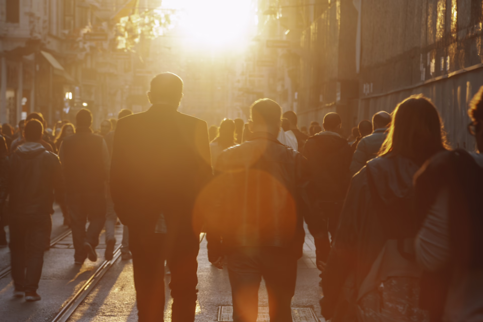 Crowd on street in bright lens flare